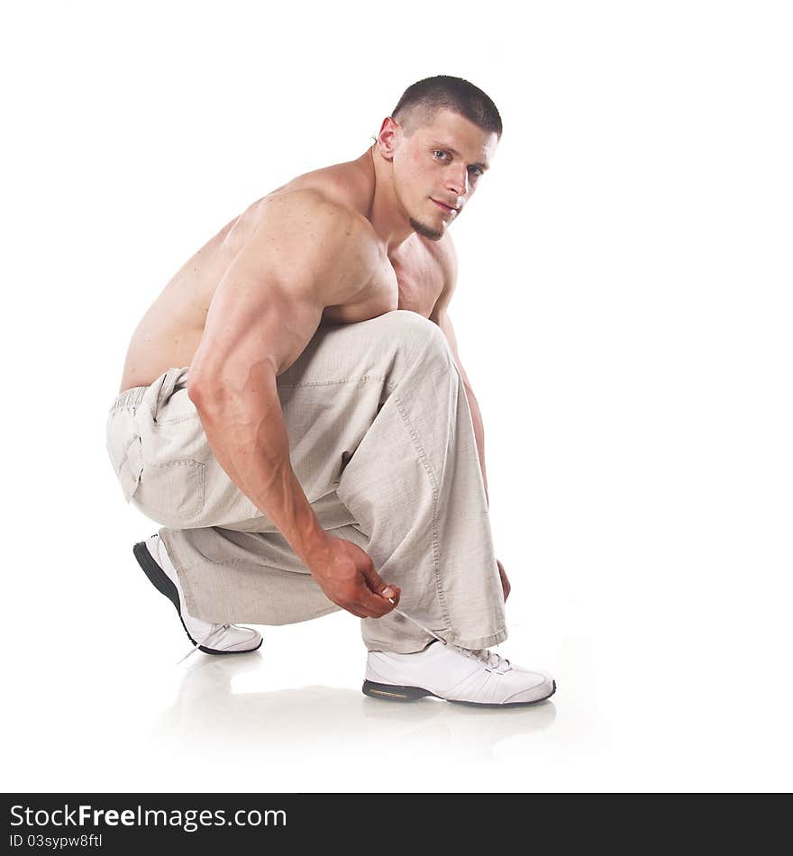 Strong athletic man isolated over white background