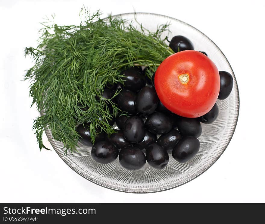 Plate of olives,sheaf of green dill and tomato isolated over white background. Plate of olives,sheaf of green dill and tomato isolated over white background.