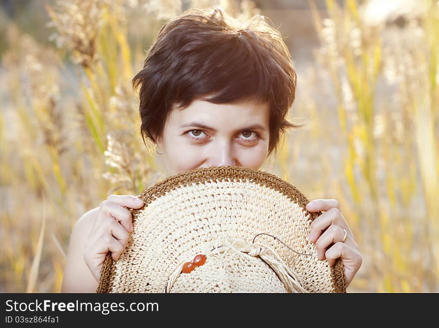 Portrait of beautiful brunette woman in summer