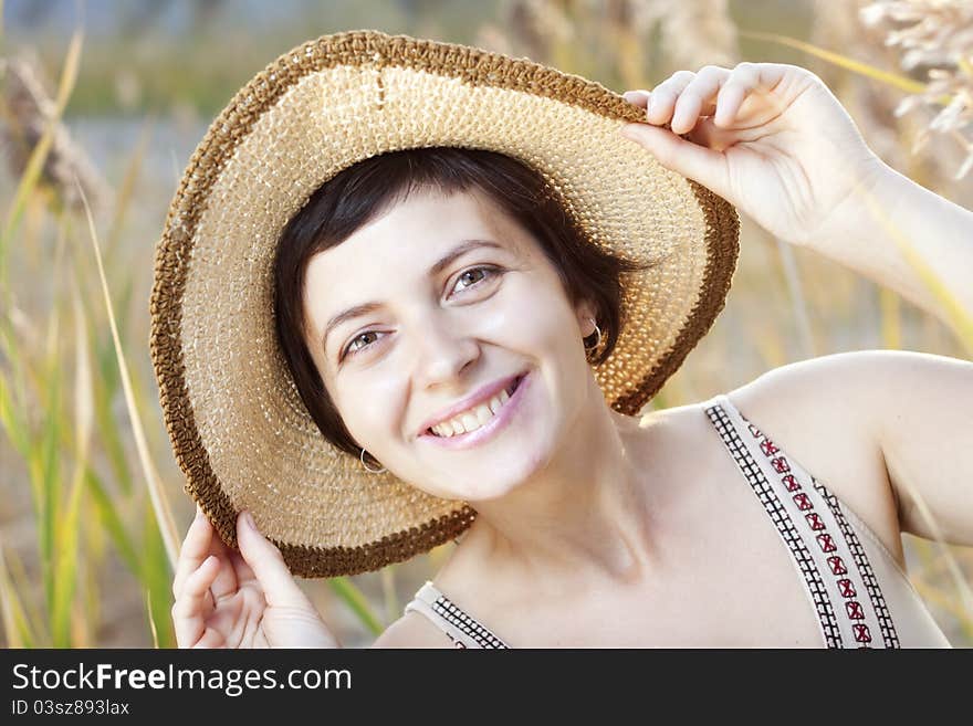 Portrait of beautiful brunette woman in summer