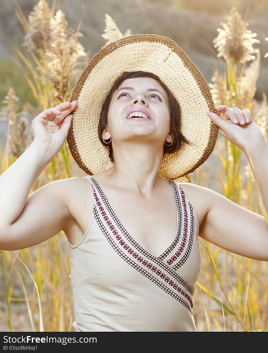 Portrait of beautiful brunette woman in summer