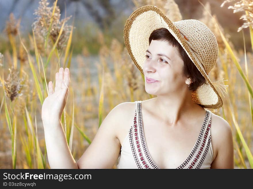 Portrait of beautiful brunette woman in summer