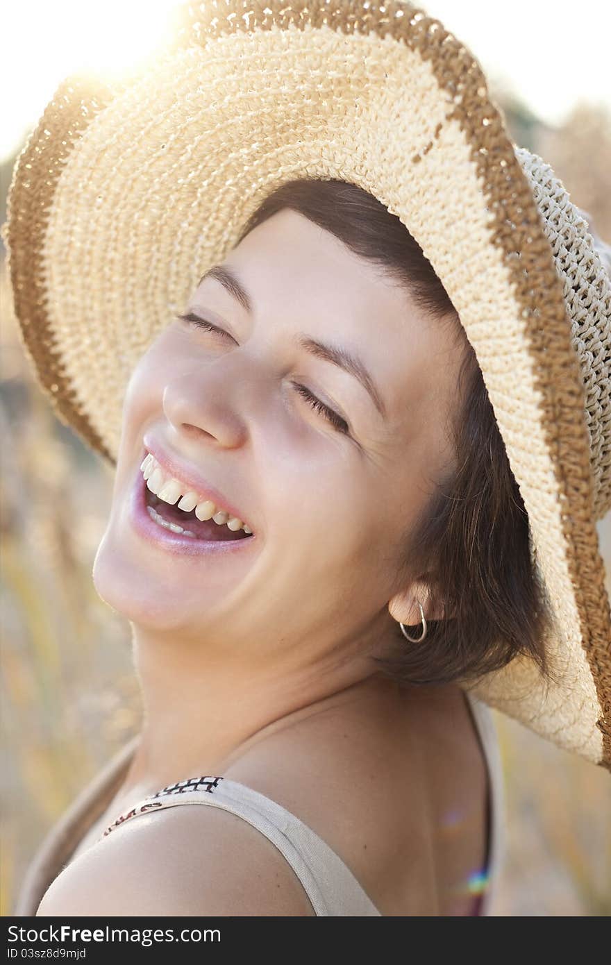 Portrait of beautiful brunette woman in summer