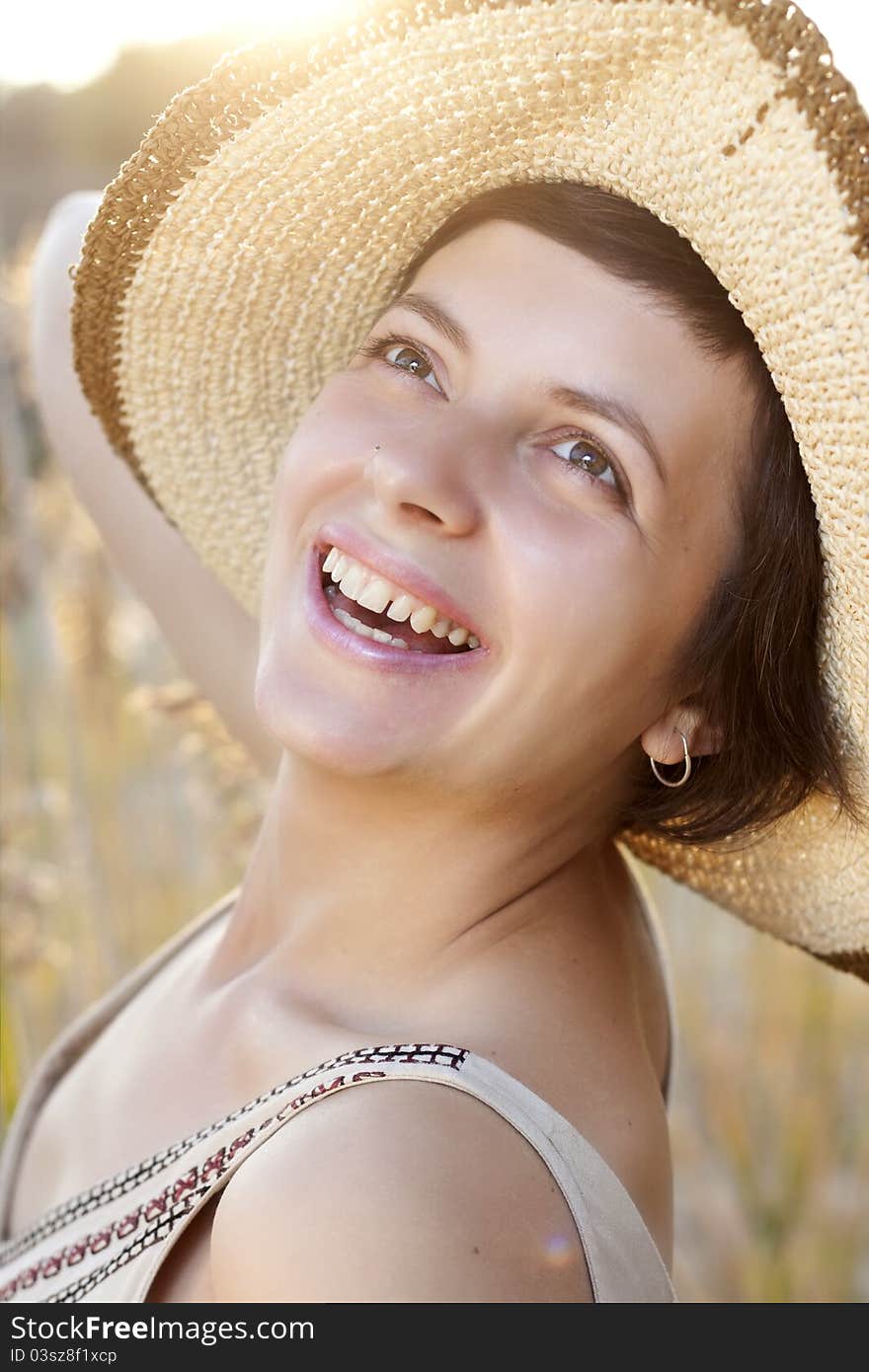 Portrait of beautiful brunette woman in summer