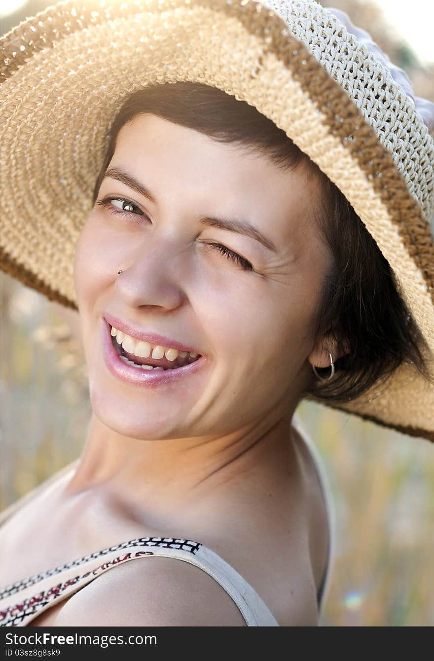 Portrait of beautiful brunette woman in summer