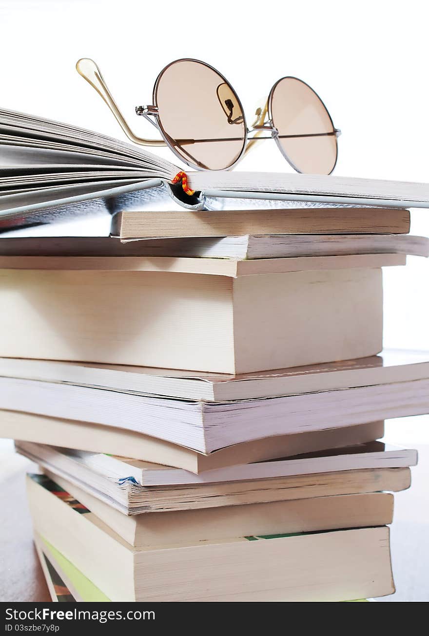 Composition with stack of books on table