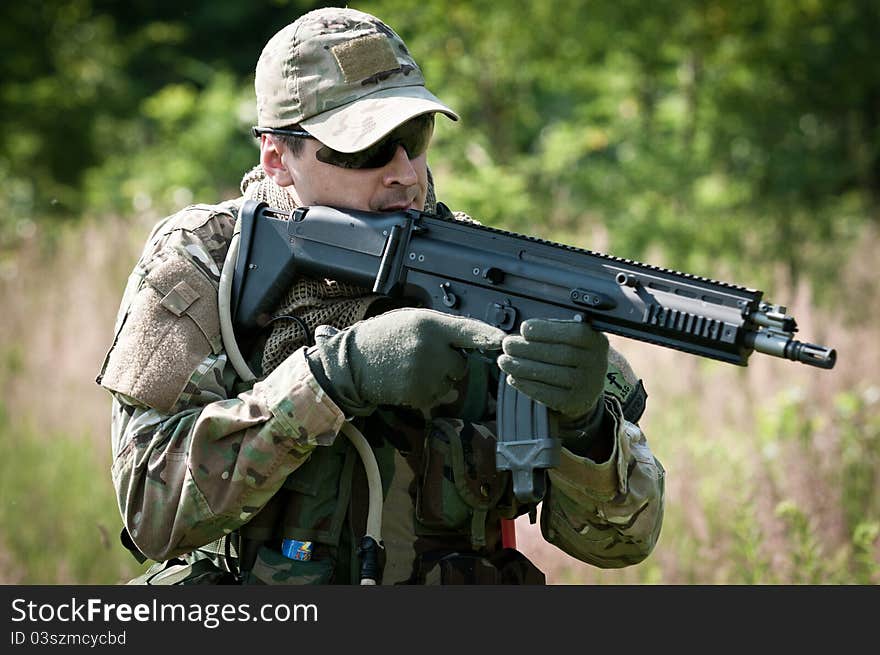 Special forces soldier during patrol on battle field. Special forces soldier during patrol on battle field