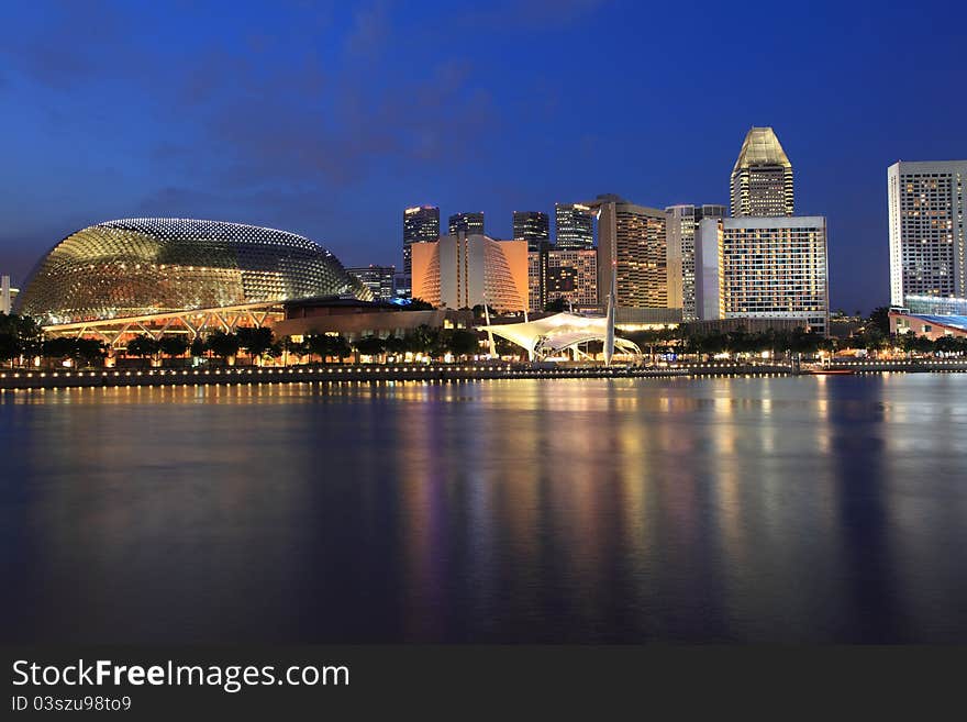 Esplanade Theater with modern building at dusk, Singapore