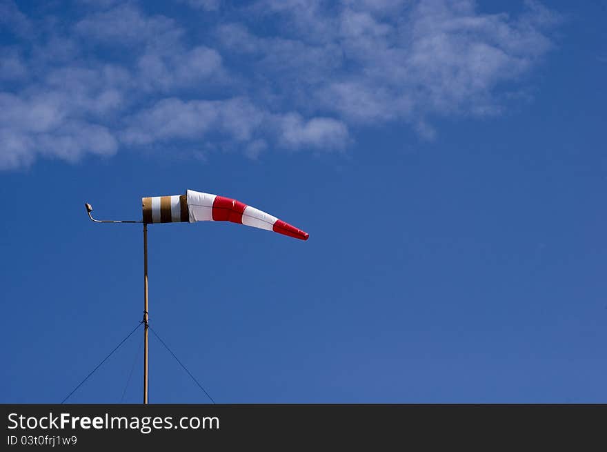 Windsock on a blue sky background