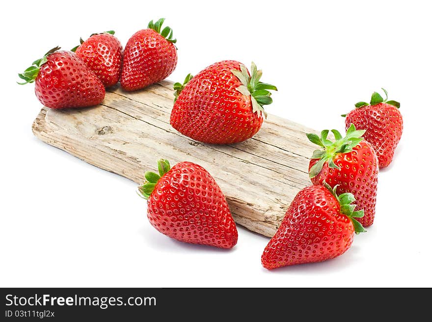 Group of strawberries over a piece of old wood. Group of strawberries over a piece of old wood