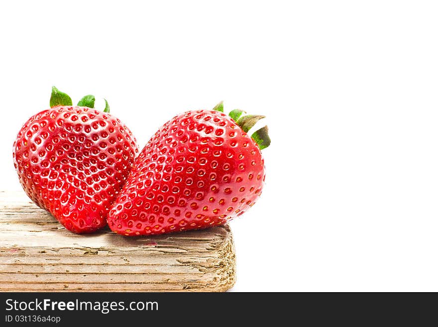 Group of strawberries over a piece of old wood. Group of strawberries over a piece of old wood