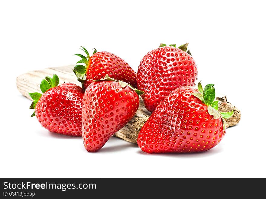 Group of strawberries over a piece of old wood. Group of strawberries over a piece of old wood