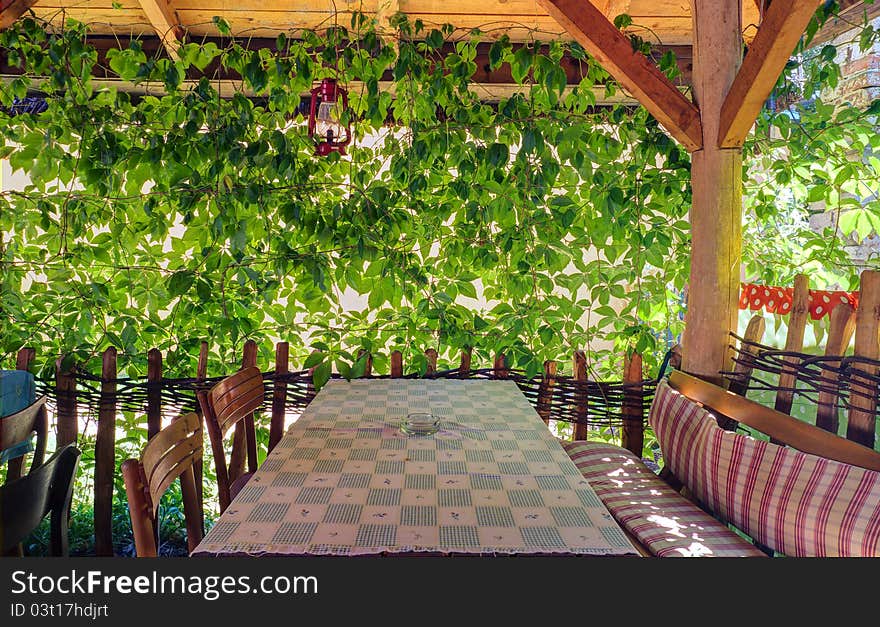 Interior of a balcony with leafs.