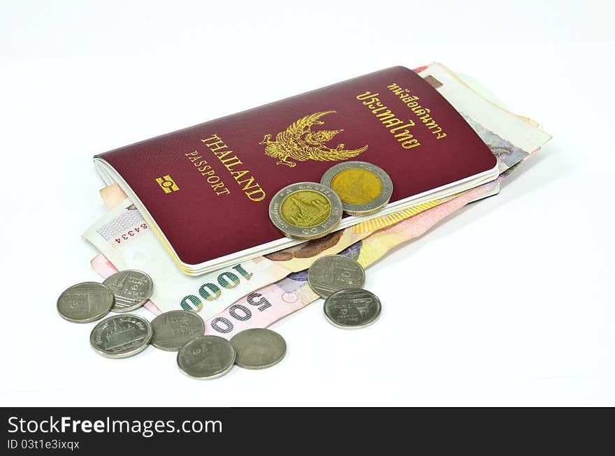 Thailand passport and Thai money on white background