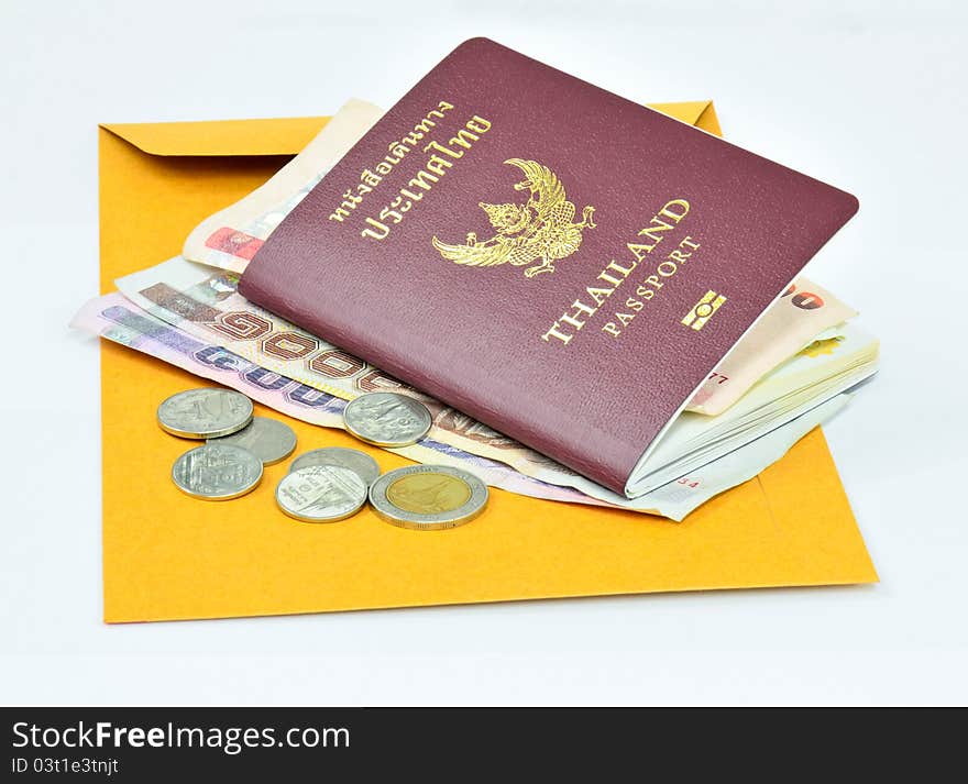 Thailand passport and Thai money on Brown envelope with white background