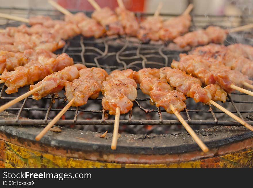 Grilled pork on hot oven at Thai market. Grilled pork on hot oven at Thai market