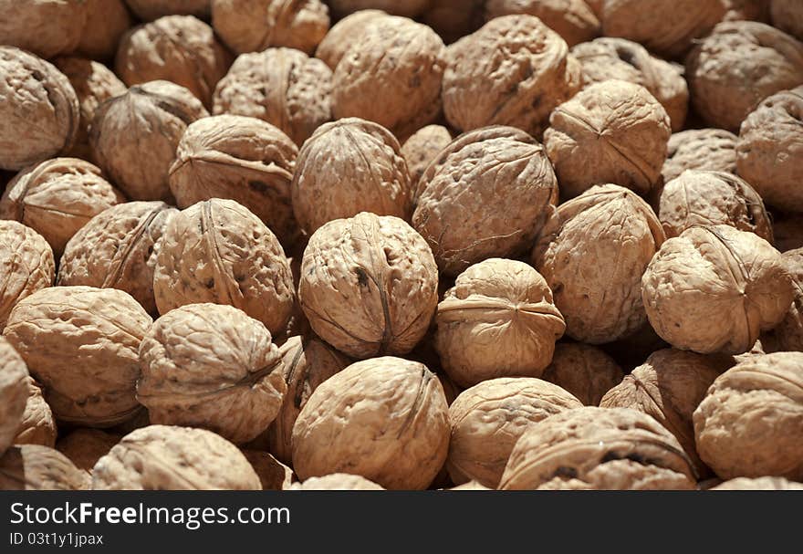 Bunch of ripe brown walnuts