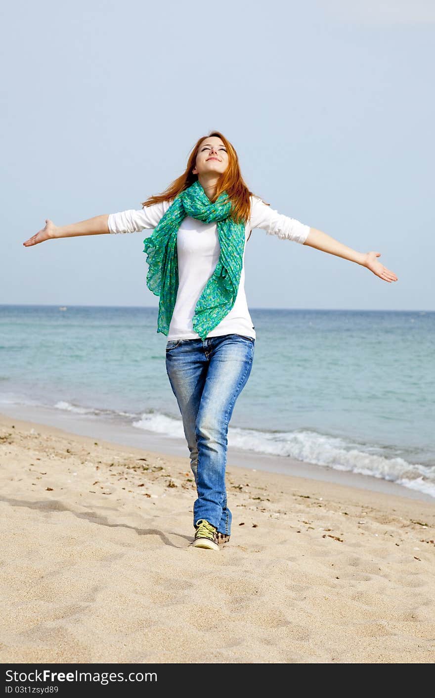 Young Beautiful Girl At The Beach.