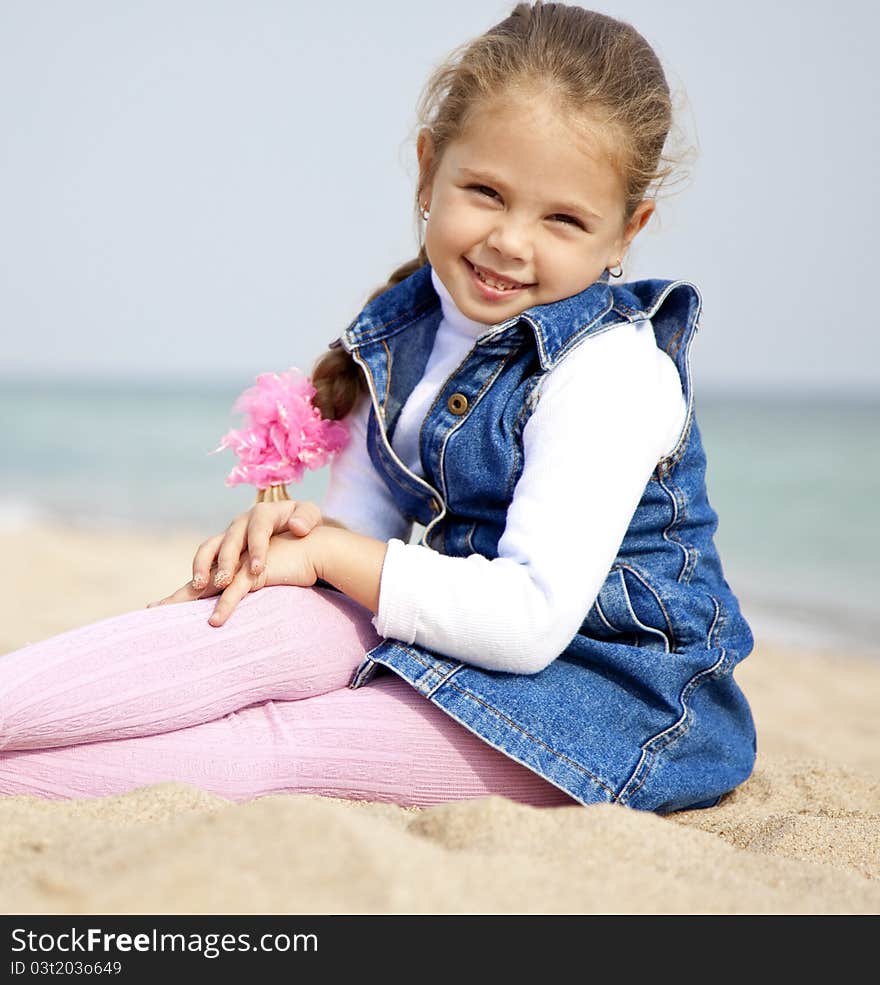 Portrait Of Cute Young Girl On The Beach