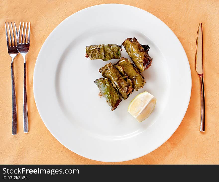 Meat balls in lemon leafs on plate