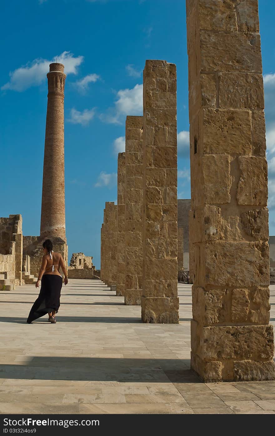 Walking woman on the ruins on oasis vendicari