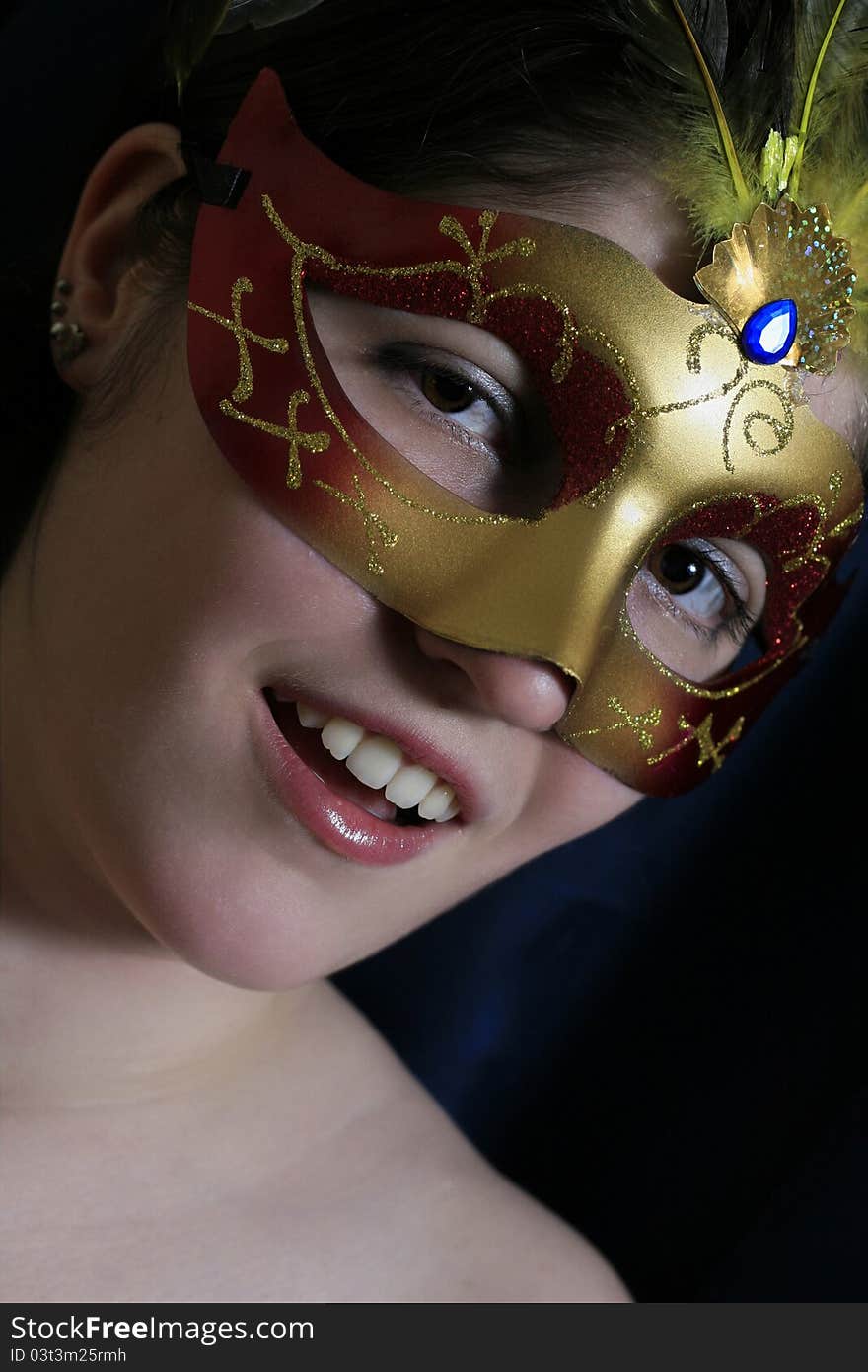 The Beautiful Young Girl In A Mask