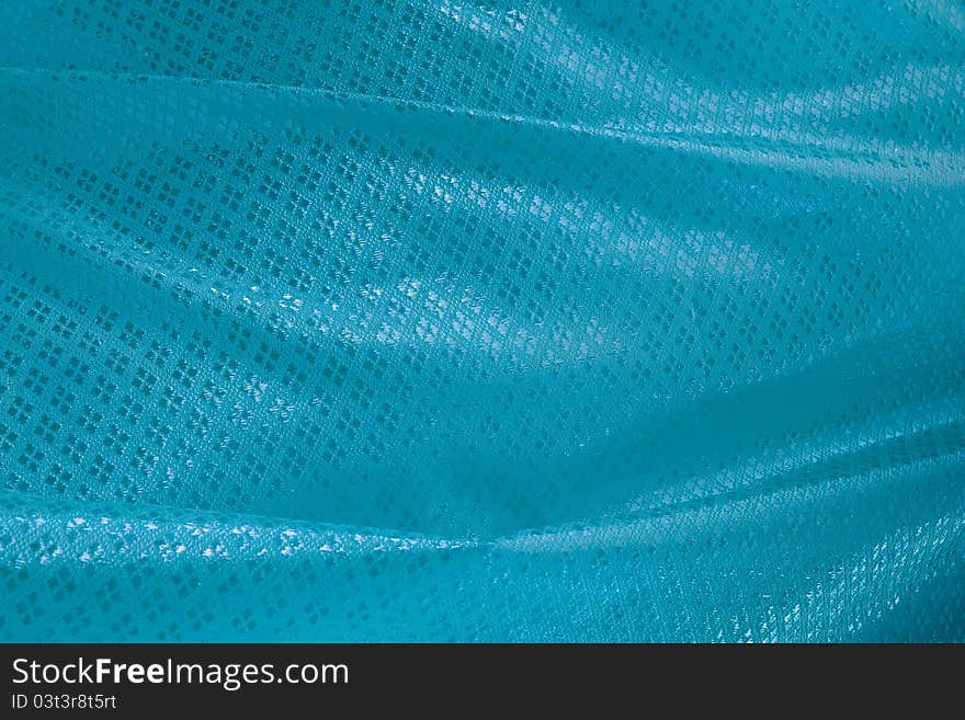 Wave of light blue textile for background