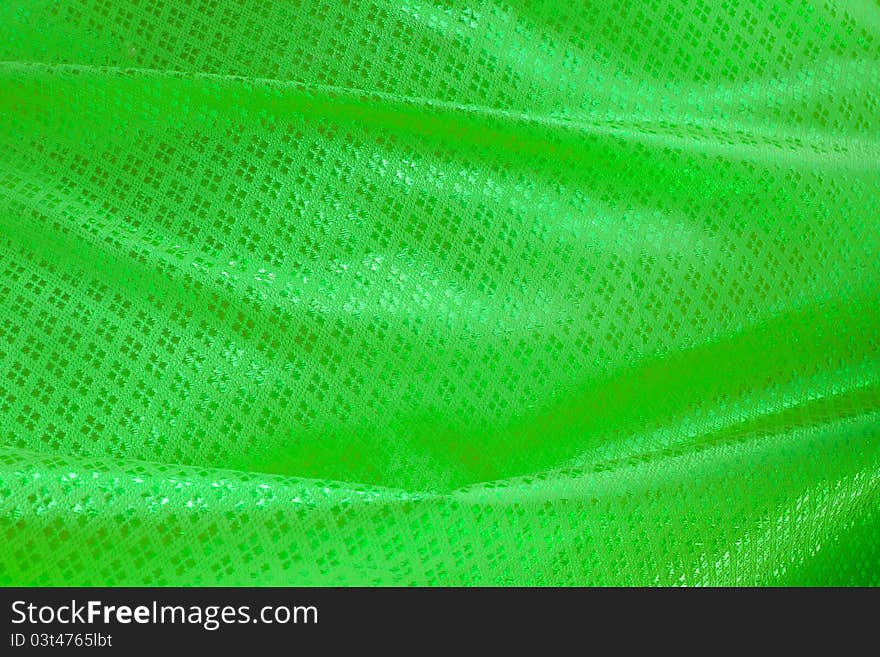 Wave of green textile for background