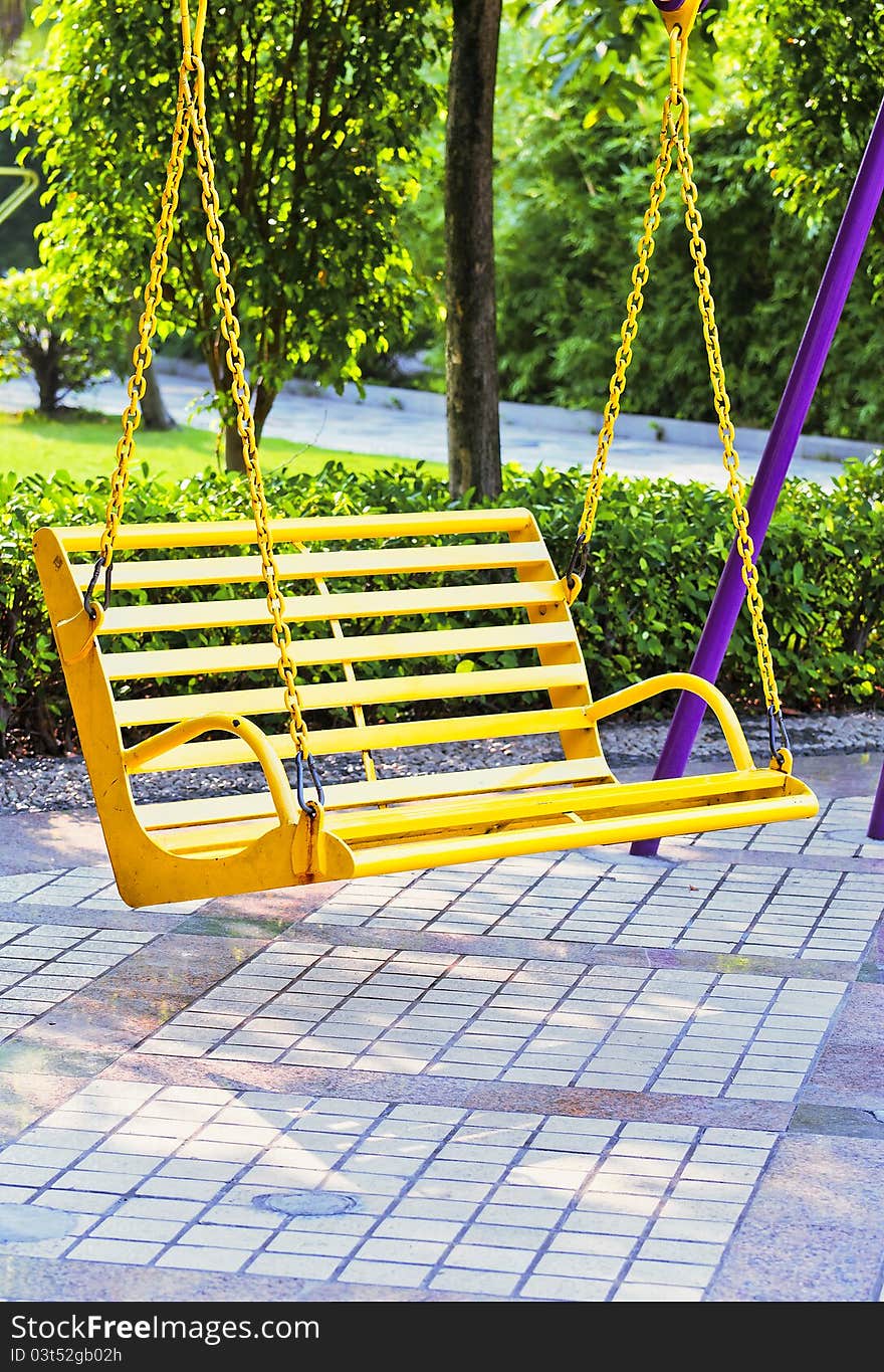 The yellow Empty swing in the park