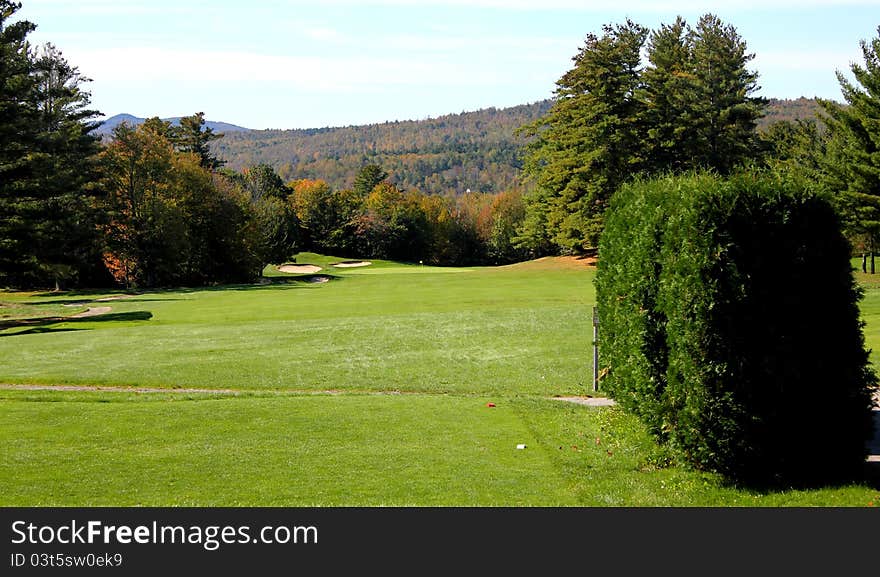 A golf fairway on a sunny, crisp autumn day