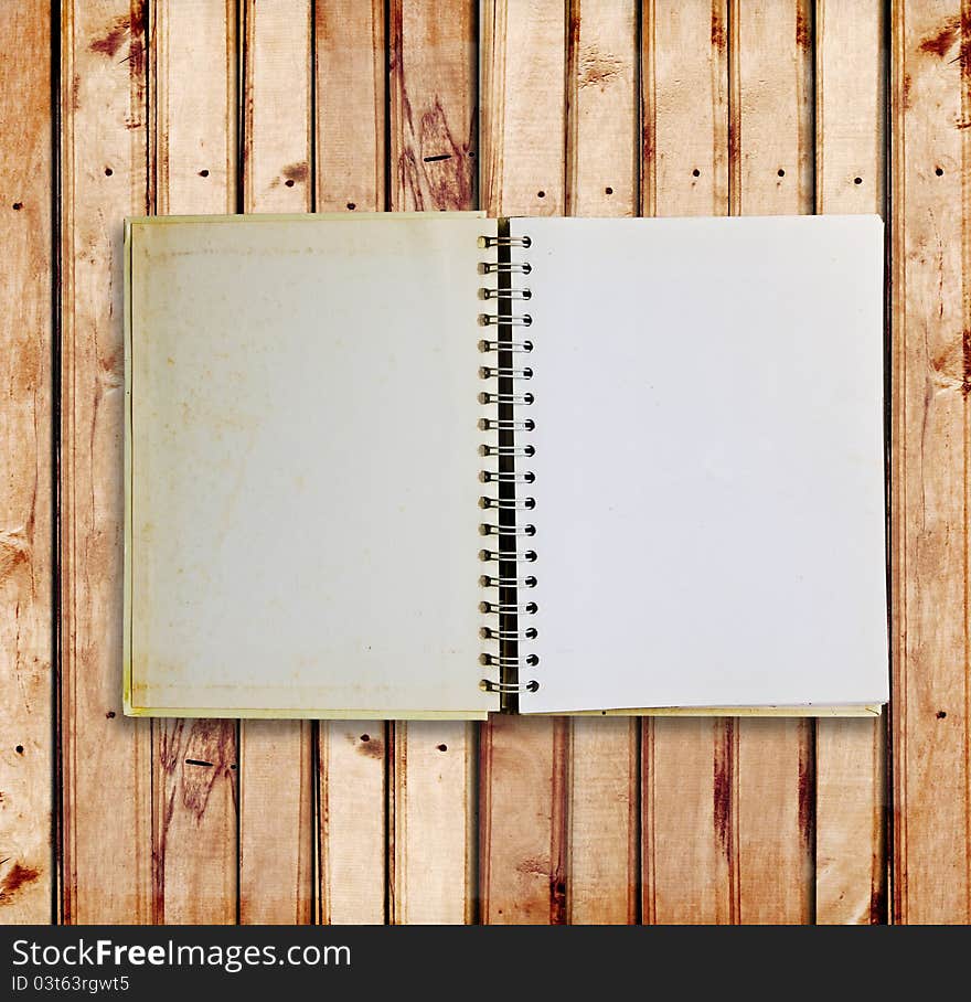 Old notebook on wood panels for background