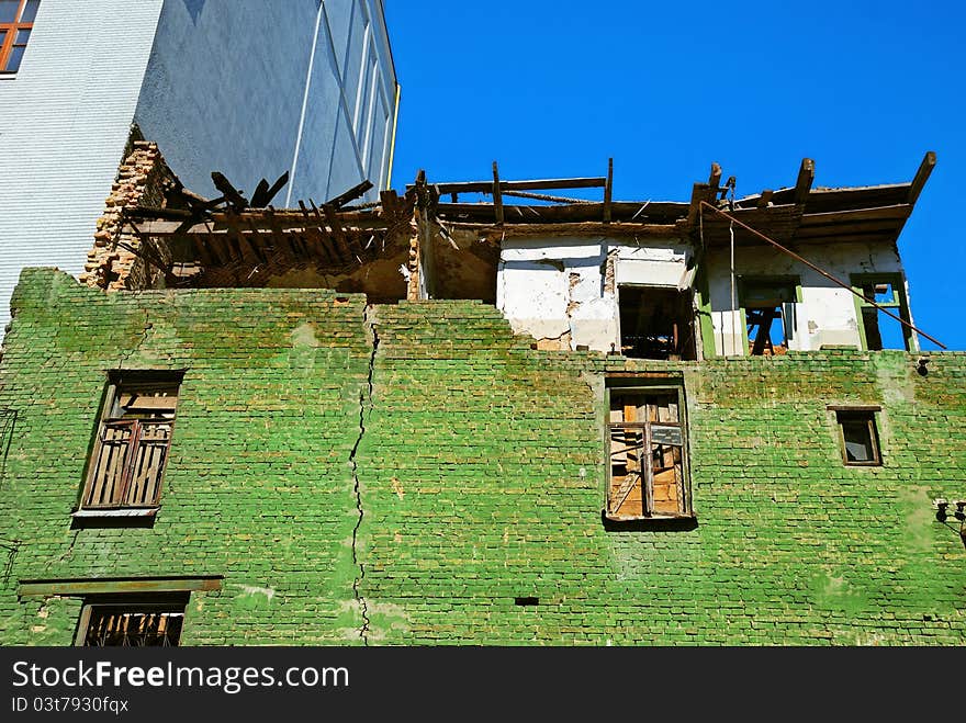 Damaged old house and crack on brick wall. Damaged old house and crack on brick wall