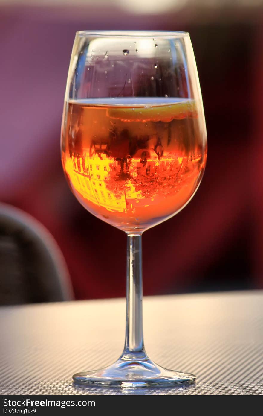 Cocktail glass with reflection of building. Cocktail glass with reflection of building