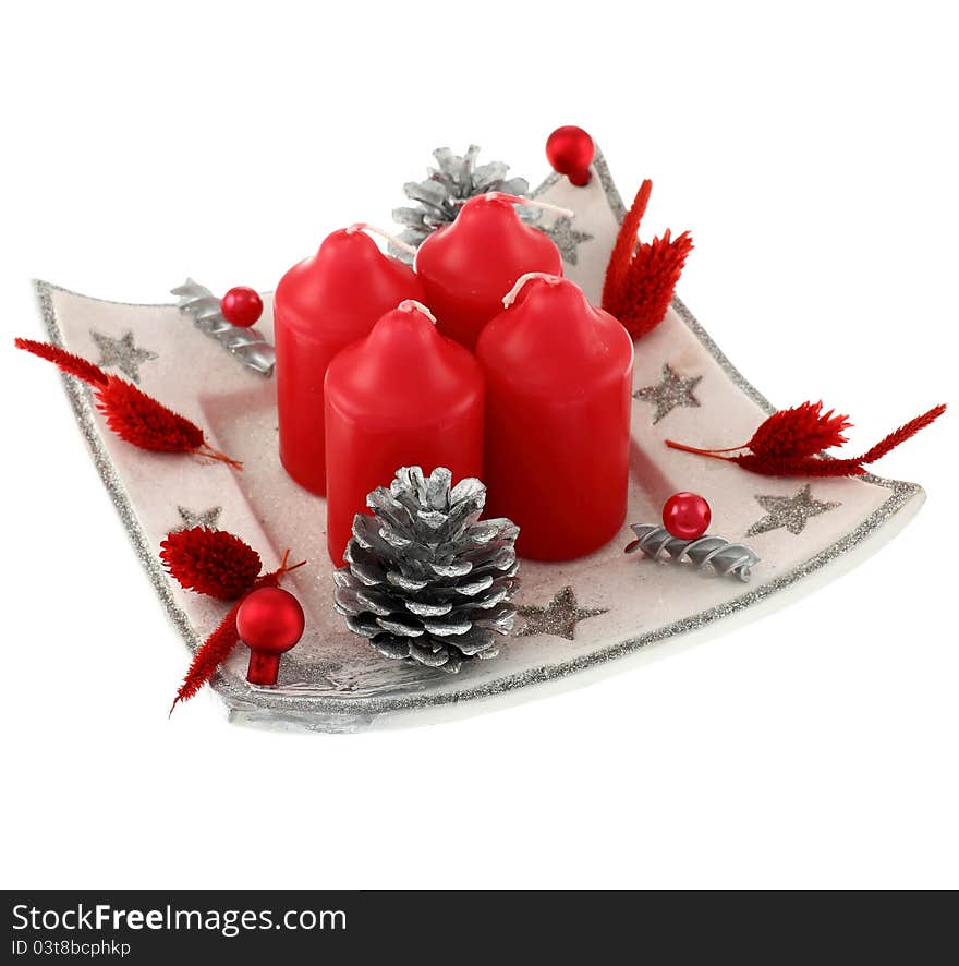 Christmas wreath isolated on white background. Focus on the foreground, intentional shallow depth of field. Studio work.