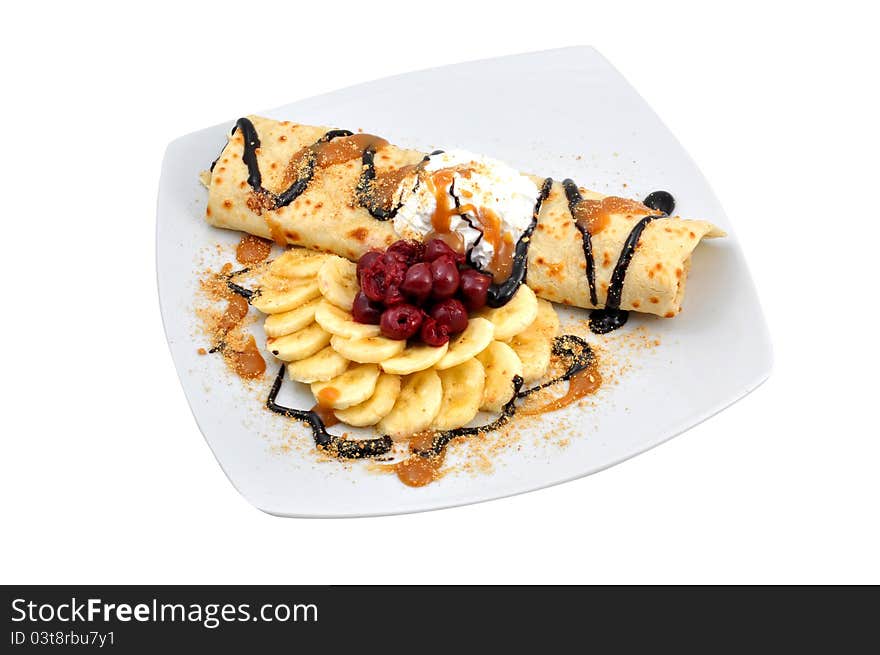 Chocolate pancake with bananas, cherries and cream. Chocolate pancake with bananas, cherries and cream