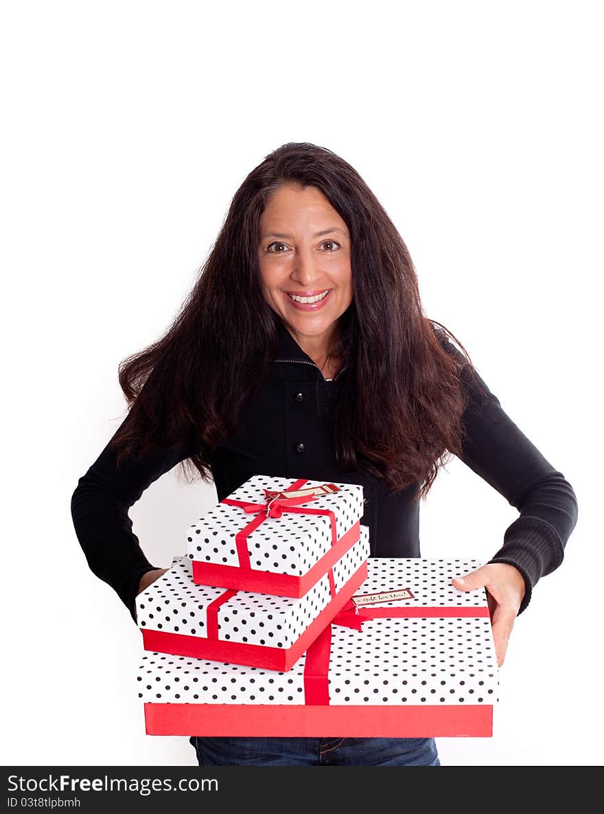 Pretty happy woman holding gifts excited about the Holidays. Pretty happy woman holding gifts excited about the Holidays