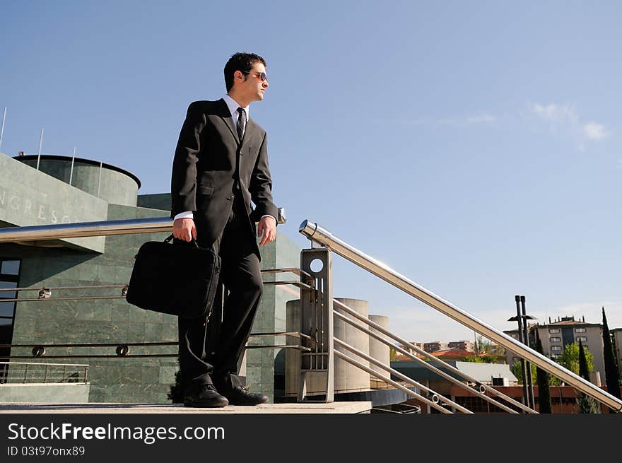 A young businessman holding a briefcase