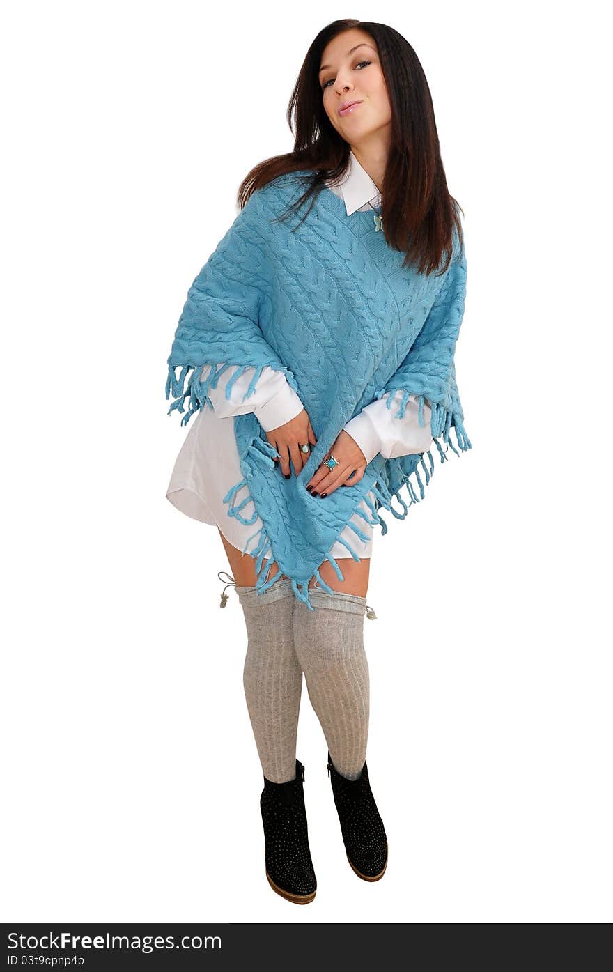 Nice girl in blue poncho poses for the camera. isolated over white