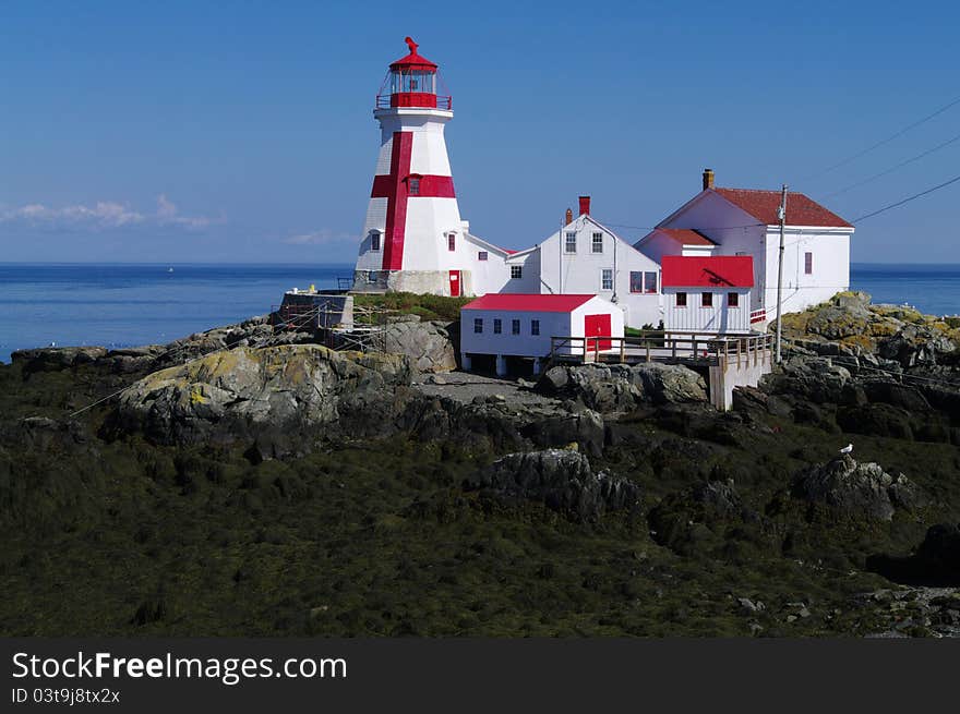 The lighthouse on the eastern coast of New Brunswick. The lighthouse on the eastern coast of New Brunswick