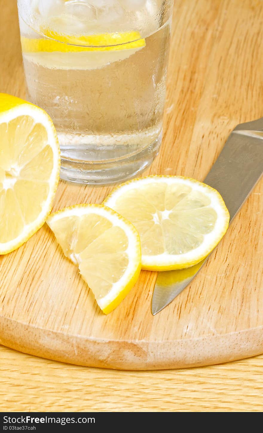 Sliced lemon on chopping board