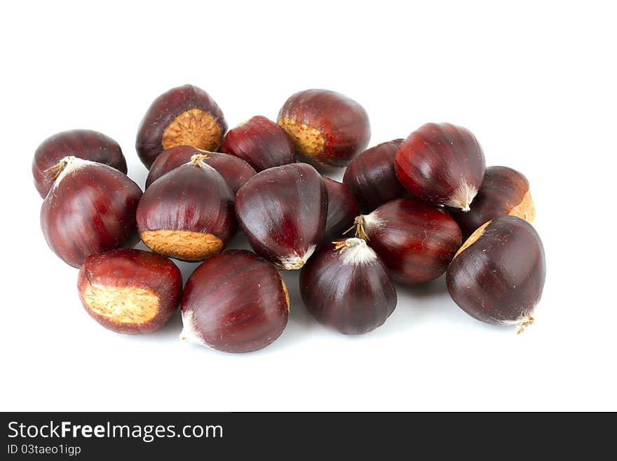 Pile of chestnuts on white background