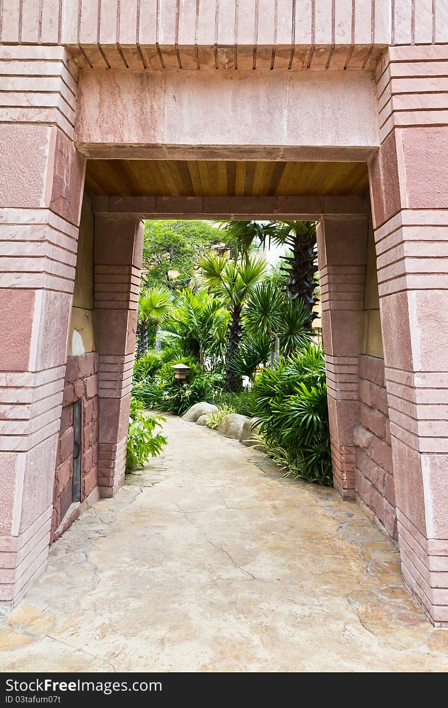 Stone gate entrance to a tunnel-shaped luxury hotel. Stone gate entrance to a tunnel-shaped luxury hotel.