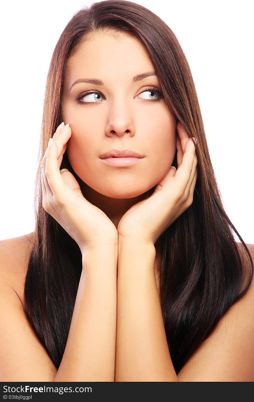 Young and beautiful woman with long hair against white background