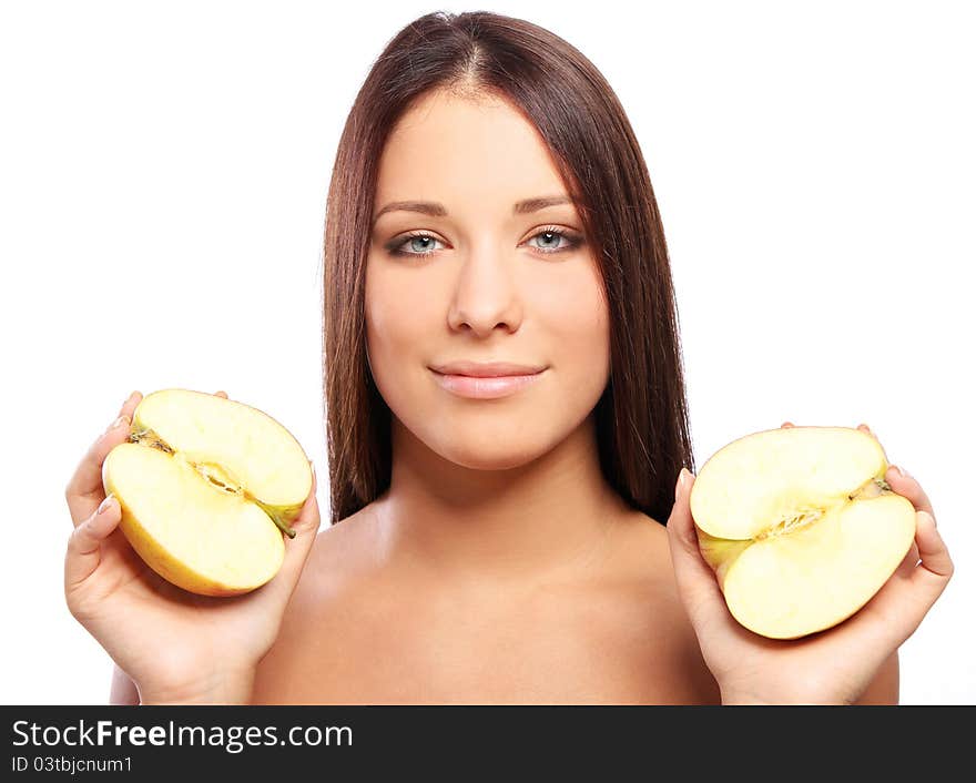 Beautiful woman with apple in hands against white background