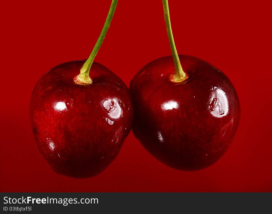 Close up of cherry against red background