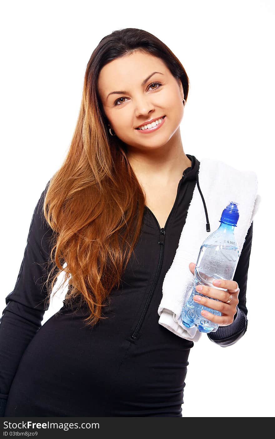 Beautiful smiling woman with  bottle of water and towel isolated over white. Beautiful smiling woman with  bottle of water and towel isolated over white