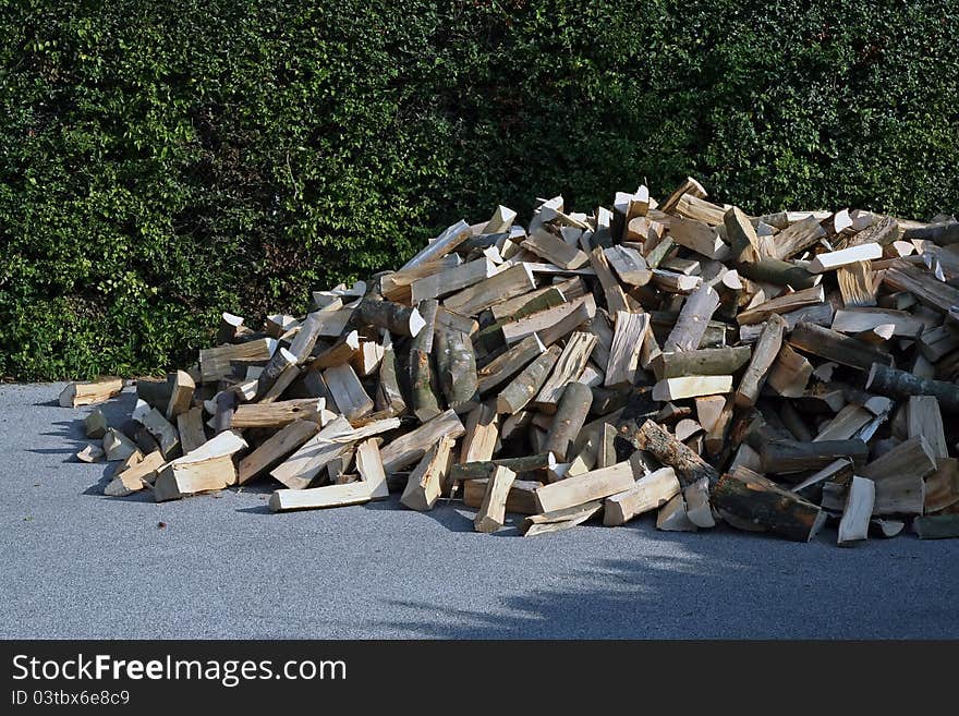 Pile of wood. Cut wood. Pile of wood on a street.