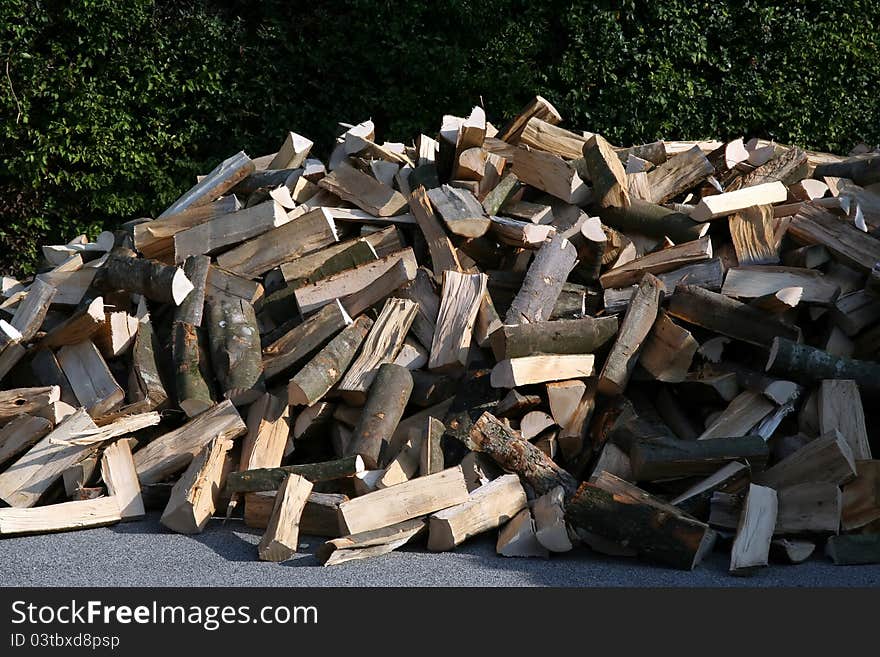 Pile of wood.
Cut wood.
Pile of wood on a street.