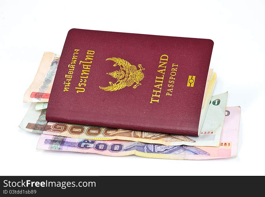 Thailand passport and Thai money on white background