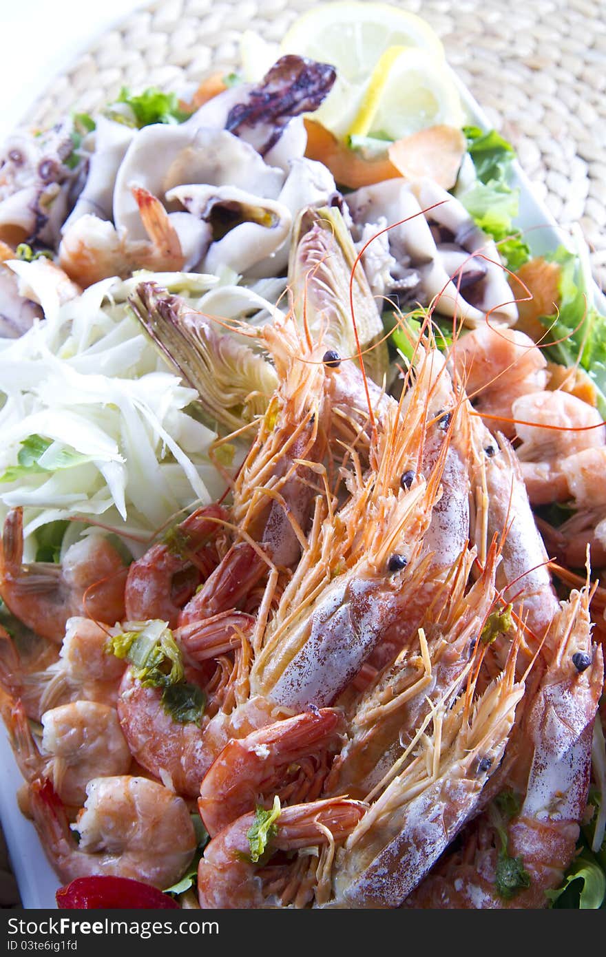 Second dish of Mediterranean cuisine, shrimp and vegetables. Second dish of Mediterranean cuisine, shrimp and vegetables.